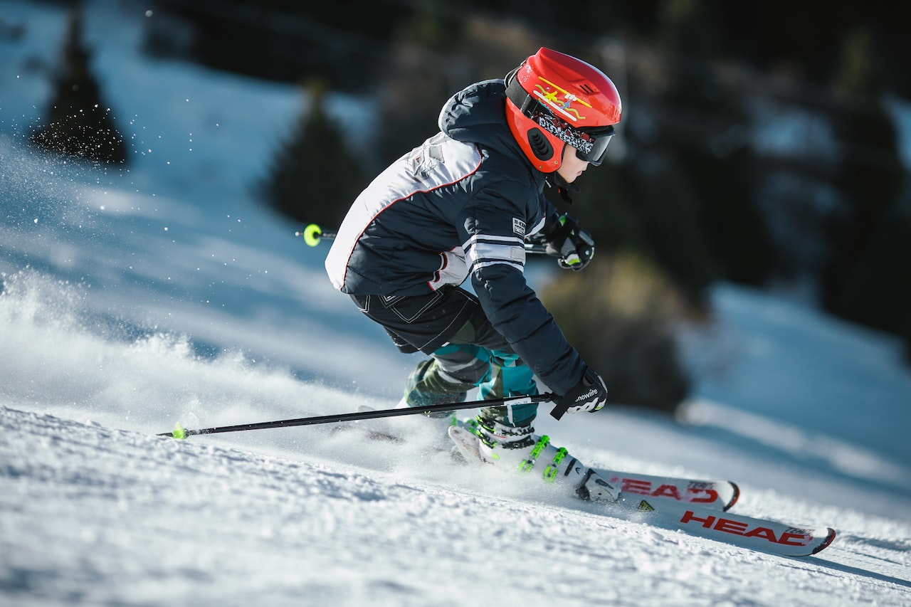 Child skiing down slope